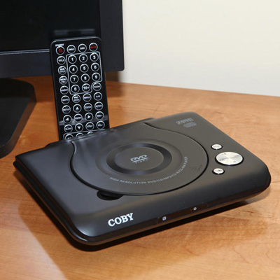 COBY® Progressive Scan DVD Player - This progressive scan DVD player is only 1.75” high, so it’s perfect for any room in your house. Plays DVD, DVD±RW, CD, CD-R, and CD-RW disks. Includes full function remote.