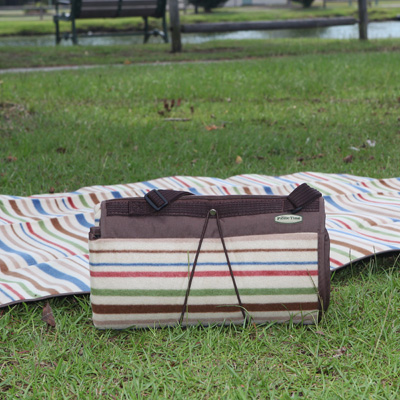 PICNIC TIME® Blanket Tote - Versatile blanket perfect for your next picnic!  The topside is soft, polyester fleece while the underside is water resistant to protect the blanket from getting damp or soiled.  Unfolds and refolds easily into a convenient carry tote featuring an adjustable shoulder strap, zippered pocket and closing flap.