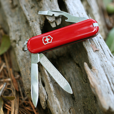 VICTORINOX® Original Swiss Army™ Knife - Small pocket knife is packed full of tools.  Includes: blade, nail file and cleaner, bottle opener, screwdriver, wire stripper, key ring, tweezers and toothpick.  Made in Switzerland. 

